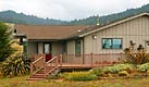 Custom redwood  wrap around deck and steps in Mendocino, CA